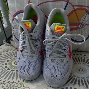 Nike Light Gray Running Shoes with Red Swoosh and Neon Yellow Accents